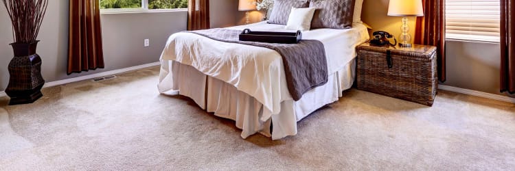 How is a room's temperature affected by carpet flooring?